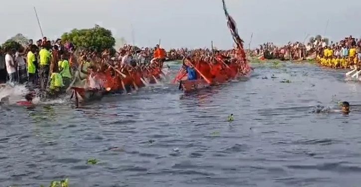 নৌকা বাইচ দেখতে আড়িয়াল বিলে হাজারো জনতার ঢল